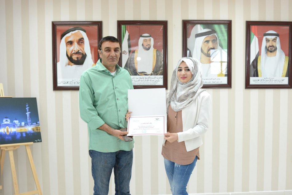 AAU President honored student Baraa Turkmany for her excellency in the Achievement Exam