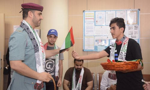 جامعة العين تشارك المؤسسات الحكومية فرحة يوم العلم